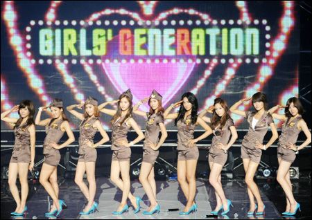 The members of Girls' Generation, attired in marine uniforms, danced,