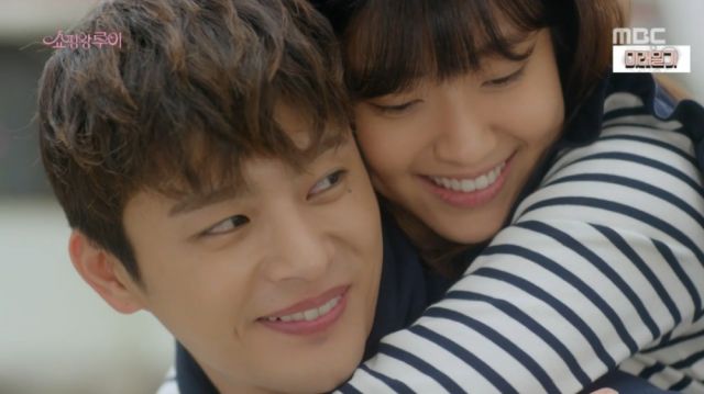 Ji-seong giving a sick Bok-sil a piggyback ride