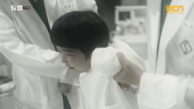 A young Seong-hoon being dragged to experiments