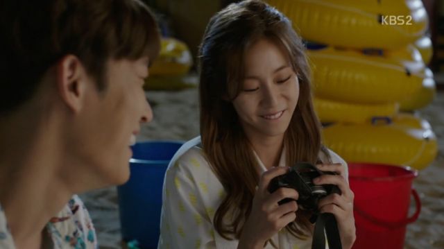 Soo-jin cherishing the camera Pil gave her