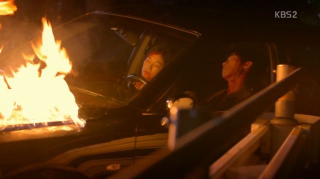 Mi-ran and Min-joon in a burning vehicle