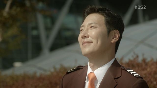 Beom-joon looking at planes with a smile